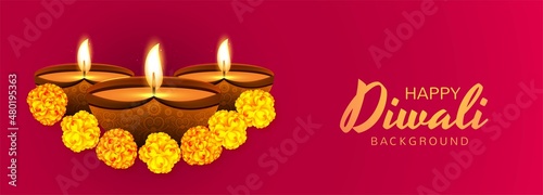 Decorated with illuminated oil lamps diwali celebration banner background