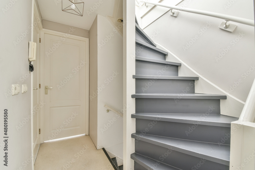 Staircase near door in modern house Staircase near door in modern house