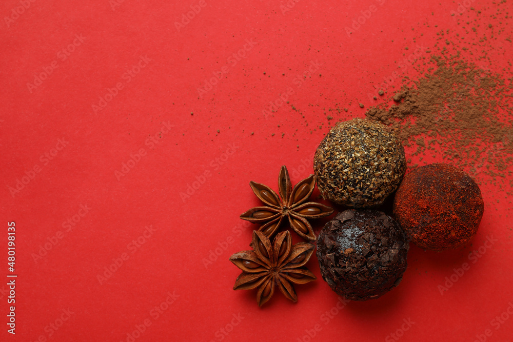 Concept of sweets with truffles on red background