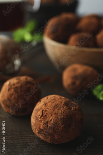 Concept of sweets with truffles on dark wooden background