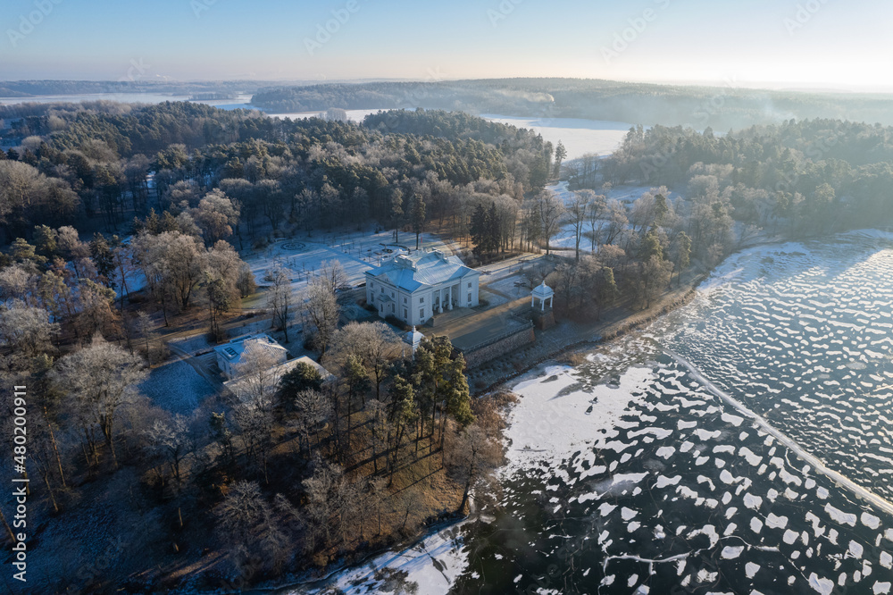 Aerial winter sunny day view of frozen Galve lake in Trakai, Lithuania