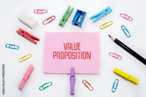Value Proposition written on Set of colorful paper clips with white copy space background