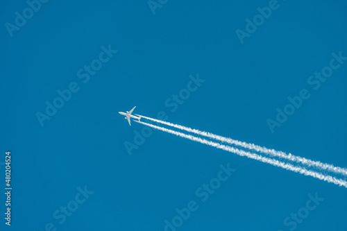 two engine jet airplane in the sky 
