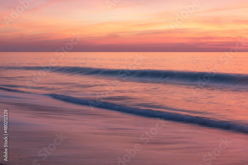 Wave movement in the reddish sunset of Alentejo
