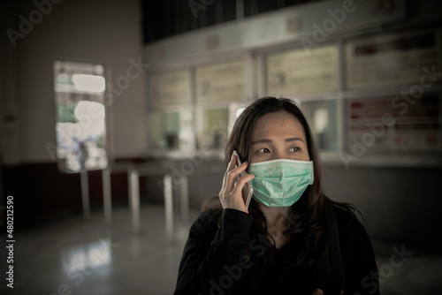 Asian traveler woman wear mask for protect coronavirus,Thai woman wearing face mask respiratory protect and filter pm2.5 (particulate matter)