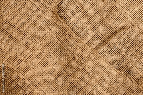 Brown sackcloth fabric close up view with shallow depth of field for texture background