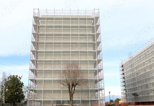 Condominium facades under complete refurbishment for improve the energy efficiency building. photo