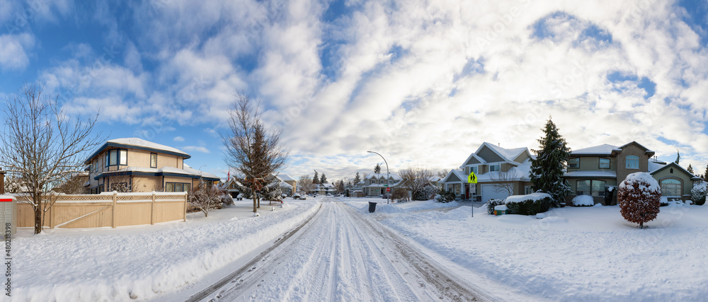 Residential Neighborhood in the Suburbs with White Snow covered road. Sunny Sunrise after snowfall. Taken in Fraser Heights, Surrey, Vancouver, BC, Canada. Panorama Residential Neighborhood in the Suburbs with White Snow covered road. Sunny Sunrise after snowfall. Taken in Fraser Heights, Surrey, Vancouver, BC, Canada. Panorama
