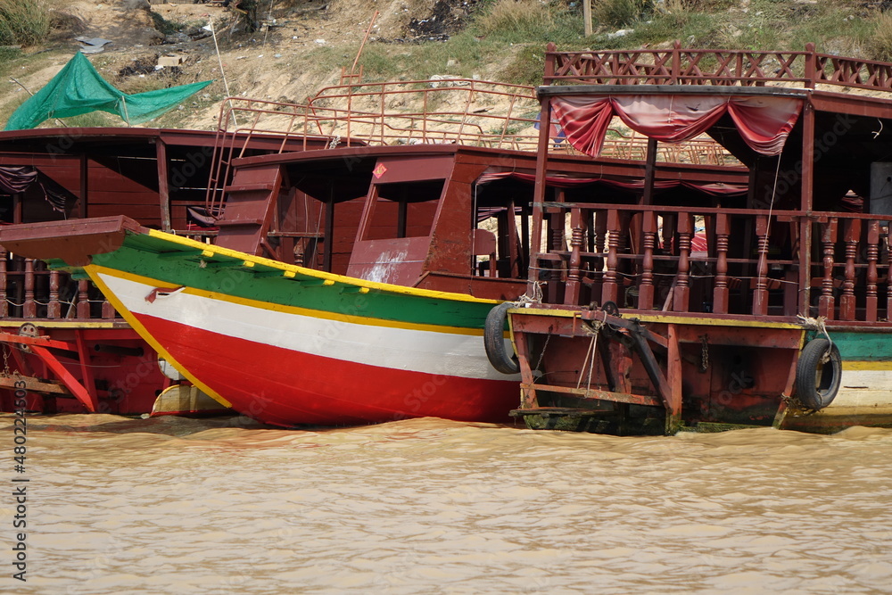 Colourful wooden boats at the shore of Lake Tonle Sap, Siem Reap, Cambodia
