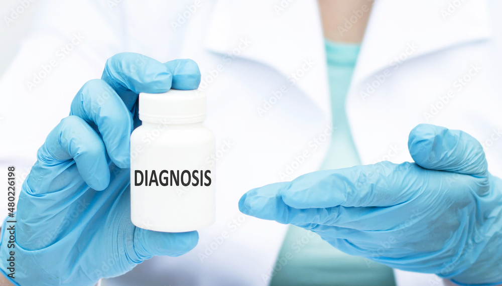 DIAGNOSIS text on the label on a white can in the hands of a doctor, close-up DIAGNOSIS text on the label on a white can in the hands of a doctor, close-up