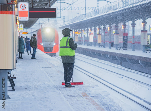 Photography Man cleans the station platform.