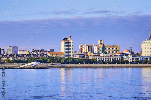 Russian-Chinese border along the Amur River. View from the embankment of the city of Blagoveshchensk, Russia to the city of Heihe, China. A mixture of architectural styles.