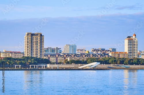 Russian-Chinese border along the Amur River. View from the embankment of the city of Blagoveshchensk  Russia to the city of Heihe  China. A mixture of architectural styles.