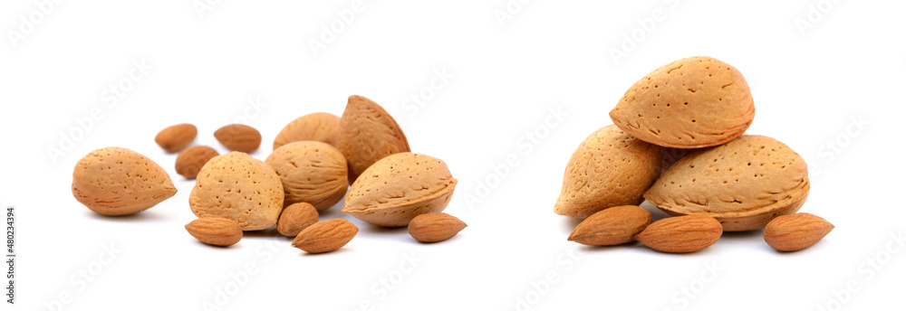 Heap of fresh almonds in shells isolated on white background Heap of fresh almonds in shells isolated on white background