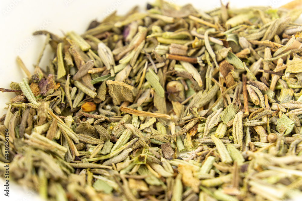 Dried spices close up. French herbs, oregano and rosemary. Dried seasoning. Dried spices close up. French herbs, oregano and rosemary. Dried seasoning.