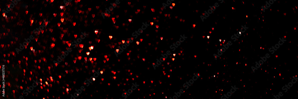 Red hearts, sparkling glitter bokeh background texture. Holiday valentines day lights. Abstract defocused header. Wide screen wallpaper. Panoramic web banner with copy space for design Red hearts, sparkling glitter bokeh background texture. Holiday valentines day lights. Abstract defocused header. Wide screen wallpaper. Panoramic web banner with copy space for design
