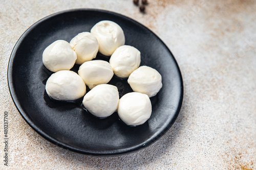 mozzarella small balls cow's milk or buffalo, goat healthy meal food snack on the table copy space food background rustic top view