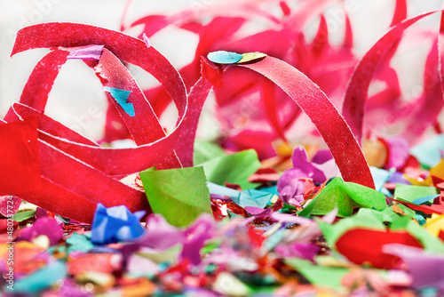 close-up of red streamers and confetti photo
