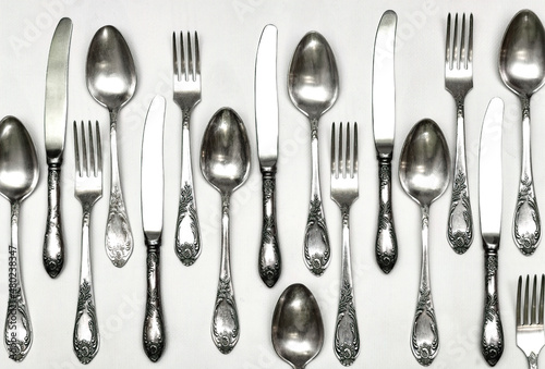 Set of vintage silver spoons and forks isolated on white background