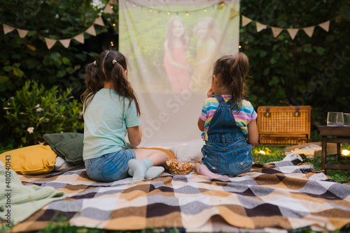 Obraz na plátně Backyard Family outdoor movie night with kids