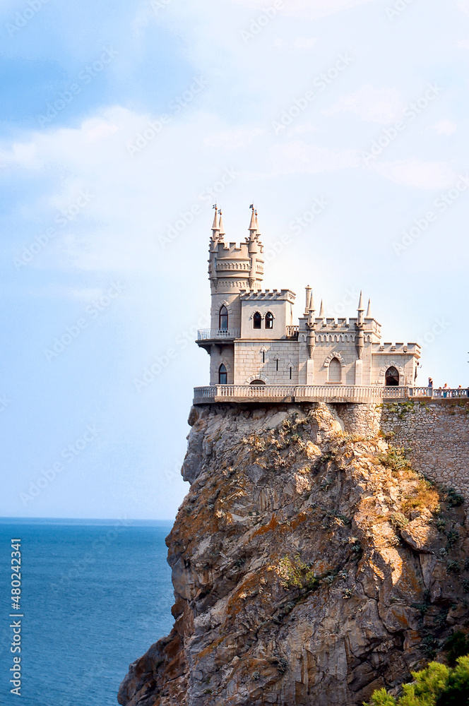 Castle of Swallow's Nest at the Black Sea coast, Crimea, Russia. It is a famous landmark of Crimea. Amazing view of Swallow's Nest on rock top in summer. Vertical photo.