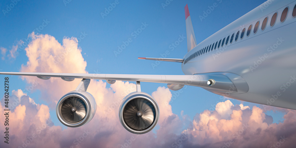 Fototapeta premium Flying airplane with blue sky and pink clouds