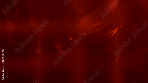 A bright cloud of smoke floats against a backdrop of red lights creating checkered pattern. Lighting equipment and smoke.The concept of holiday, show or theatrical performance. Close up. Slow motion. photo