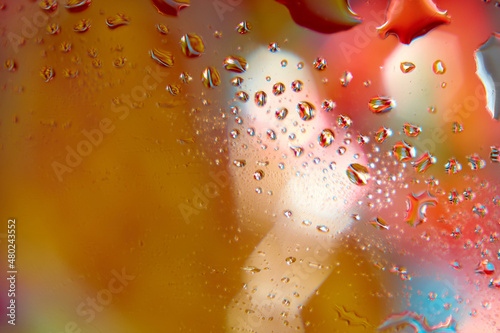 Colorful blurred background with water drops. Closeup.