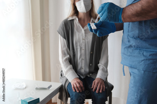 Doctor examining with antigen test at the patient's home