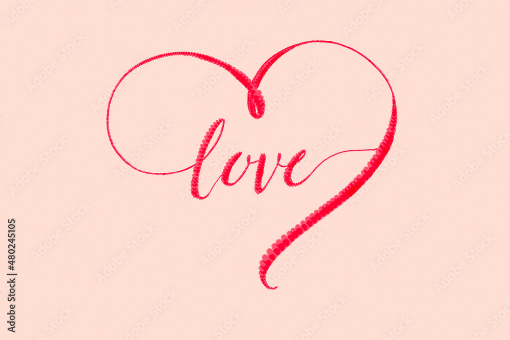 Letters Love and big heart around composed of many little hearts on the gentle rose background