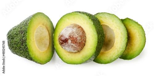 Avocado cut into pieces on a white background. Isolated, top view