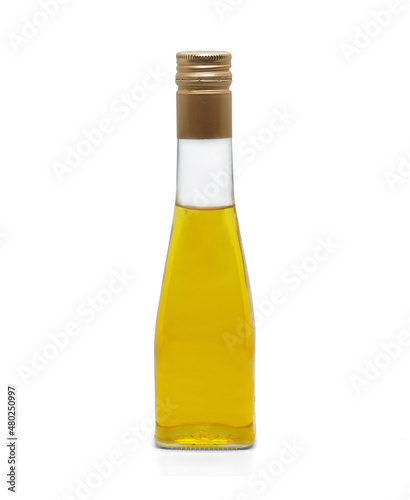 glass bottle with vegetable oil isolated on white background