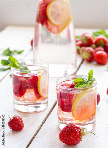 fresh lemonade with strawberries , lemon and mint