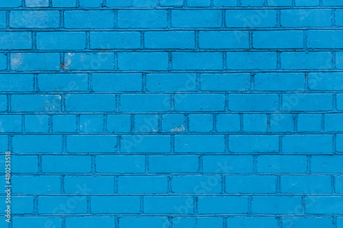 Painted brick wall in blue paint texture stone background