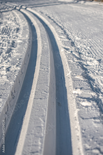 cross-country ski trail track in the snow © Martins