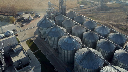 Aerial Drone View Flight Over Elevator Complex. Top View Buildings and Metal Structures for Drying and Storing Grain. Large Metal Silos for Storage of Grain Crops. Agricultural and Food Technologies