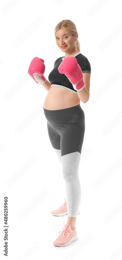 Fototapeta premium Young pregnant woman in boxing gloves on white background