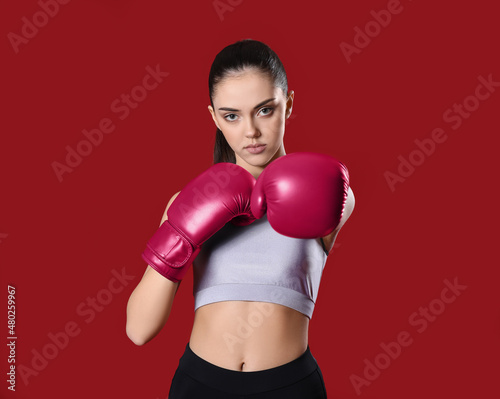 Sporty young girl in boxing...
