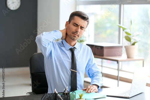 Businessman feeling backach...
