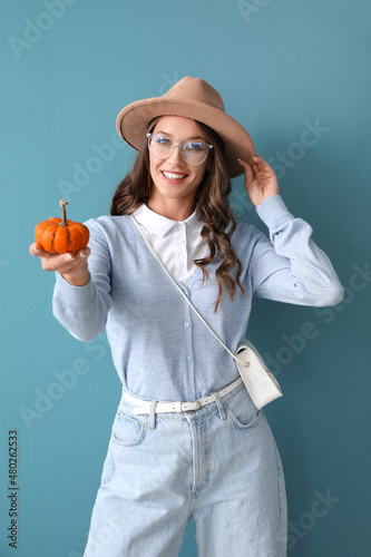 Young smiling woman holding...