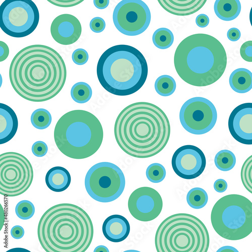 Abstract geometric circle seamless pattern. Green and blue circles on white background.
