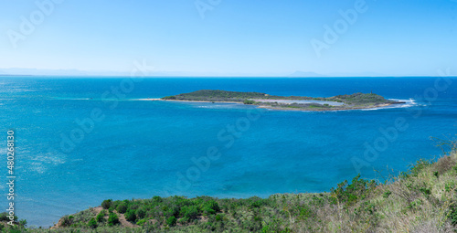 Panoramic view of an island in the sea with a lake in the center