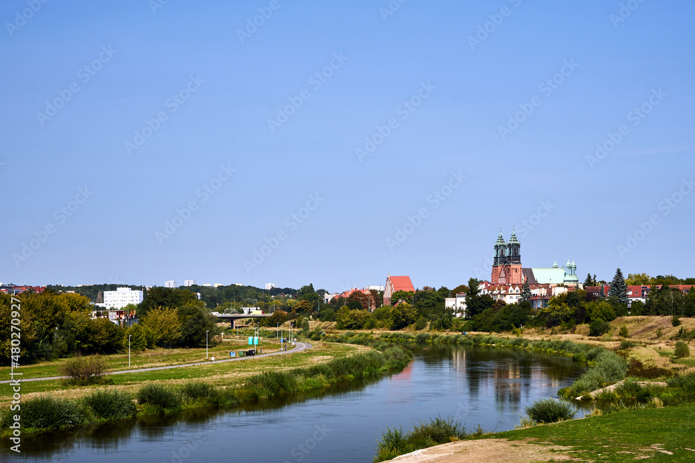 The towers of the gothic cathedral on the Warta river