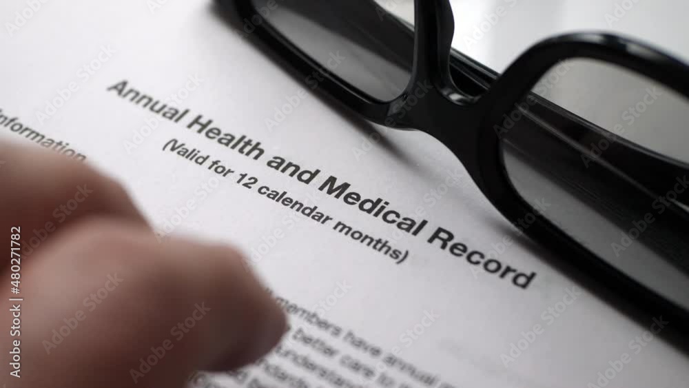 Finger tapping on health and medical record Finger tapping on health and medical record
