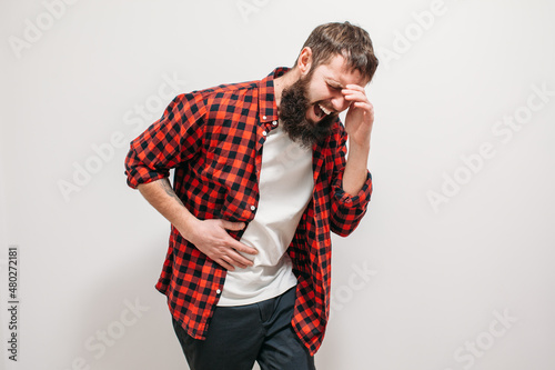 A sick man is in severe pain due to gallstones. A young man with a beard suffers from gallbladder disease. Copy space for your text. photo