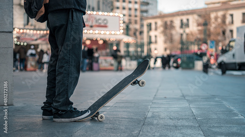 Teenager playing with a skateboard