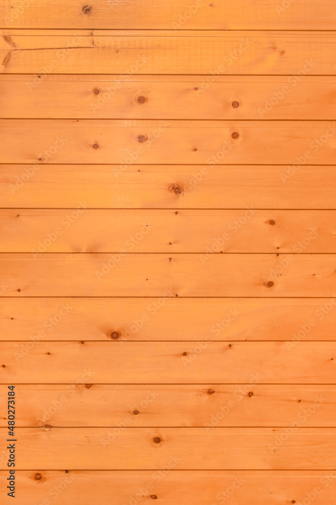 Bright orange or brown wooden texture of the interior of the background board Bright orange or brown wooden texture of the interior of the background board