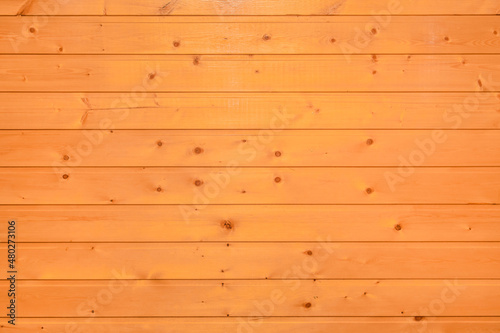 Bright orange or brown wooden texture of the interior of the background board