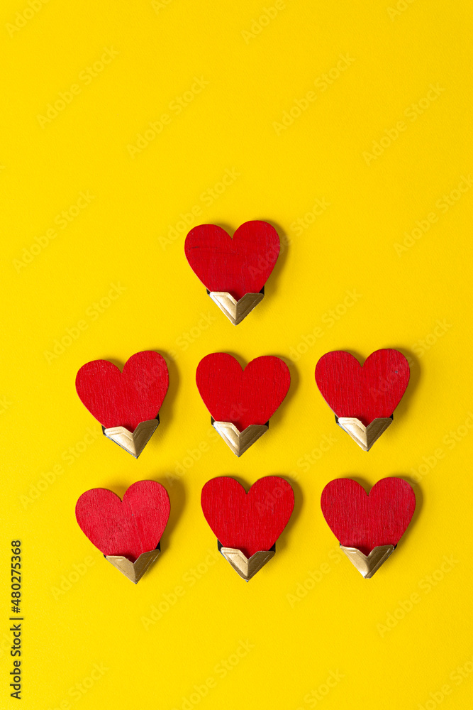 red hearts with photo corners on yellow 