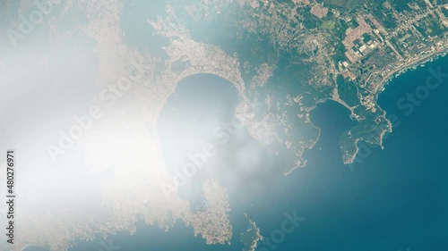 Flying over Acapulco bay satellite view from space of city and Pacific ocean. Animation based on images by Nasa photo